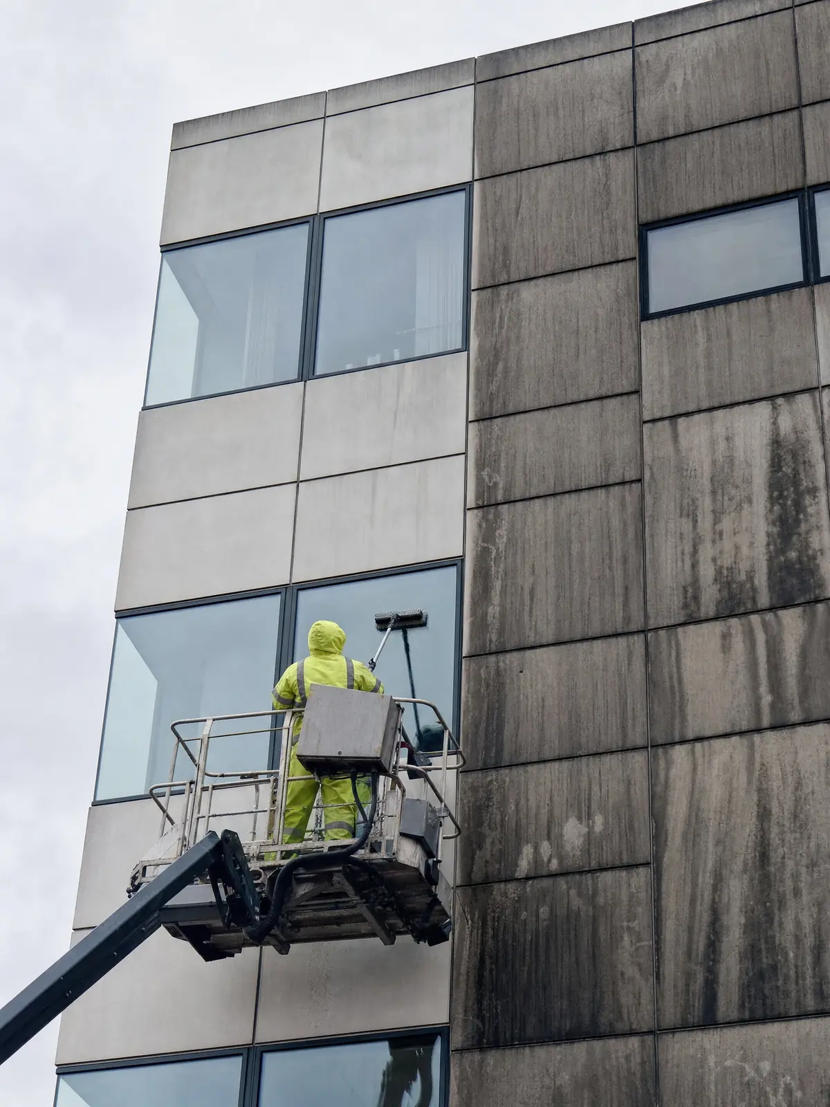 Cleaning the facade of a modern office building