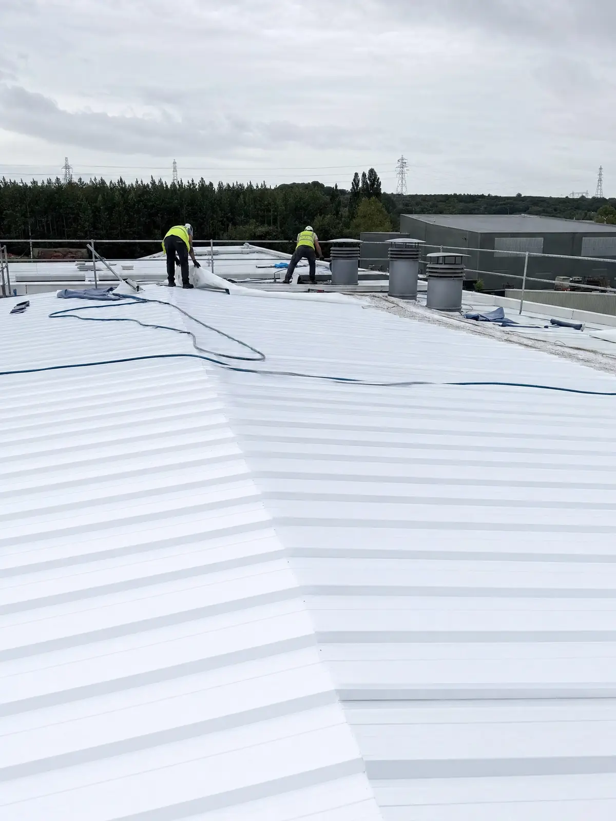 A freshly coated commercial roof with equipment removed at completion