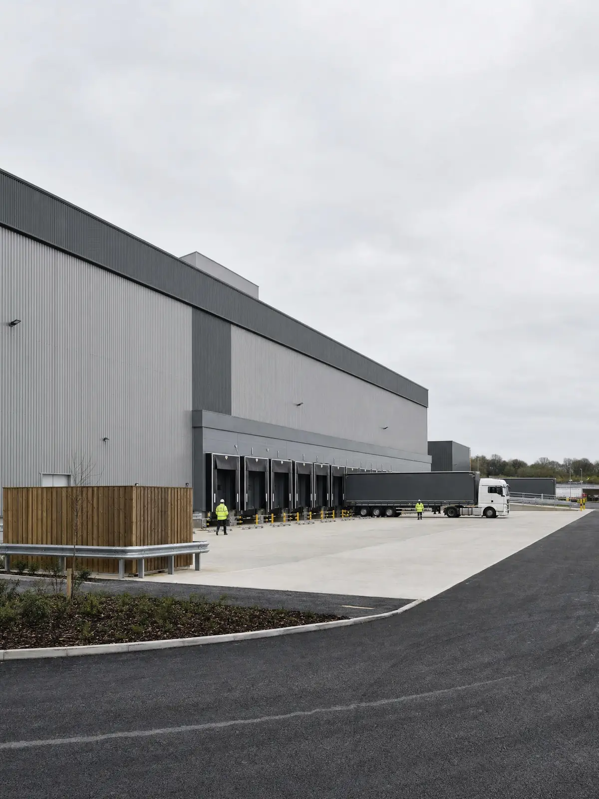 Wide exterior of a large distribution warehouse and yard